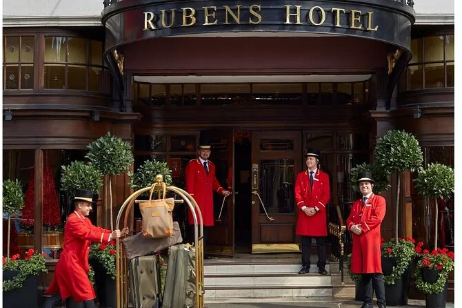 Doormen in red coats outside a London hotel